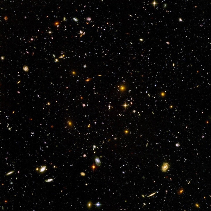 The Hubble Ultra Deep Field: thousands of distant galaxies scattered across black sky
